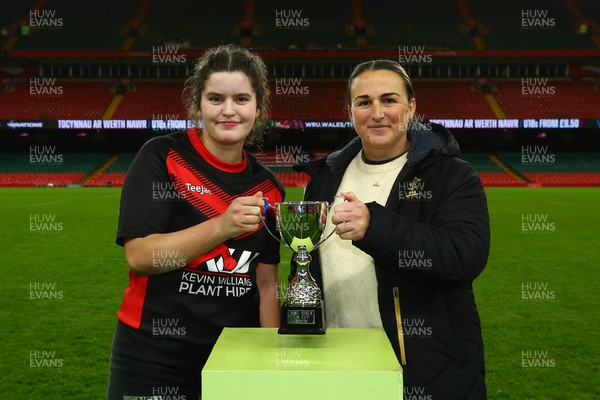 061225 - Cardiff Quins v Gwylliad Meirionnydd - WRU Girls U18 Hub Final - Captain of Gwylliad Meirionnydd Efa Thorp receives the trophy from Siwan Lillicrap of WRU