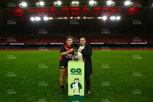 061225 - Cardiff Quins v Gwylliad Meirionnydd - WRU Girls U18 Hub Final - Captain of Gwylliad Meirionnydd Efa Thorp receives the trophy from Siwan Lillicrap of WRU