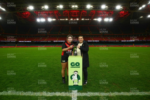 061225 - Cardiff Quins v Gwylliad Meirionnydd - WRU Girls U18 Hub Final - Captain of Gwylliad Meirionnydd Efa Thorp receives the trophy from Siwan Lillicrap of WRU