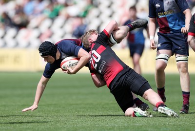 050525 - Cardiff Quins v Llanishen - U18 Bowl Final - Boys U18s Finals Day - James Harding of Cardiff Quins is tackled by Kaylum Kelly of Llanishen 