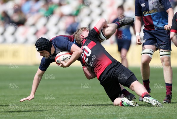 050525 - Cardiff Quins v Llanishen - U18 Bowl Final - Boys U18s Finals Day - James Harding of Cardiff Quins is tackled by Kaylum Kelly of Llanishen 
