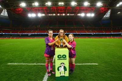061225 - Cardiff Quins v Nelson Belles - WRU Girls U16 Hub Final - Captains of Cardiff Quins Alys Roberts(L) and Medi Roberts receive the cup from Carol Thomas of WRU