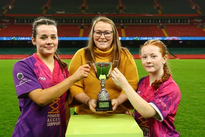 061225 - Cardiff Quins v Nelson Belles - WRU Girls U16 Hub Final - Captains of Cardiff Quins Alys Roberts(L) and Medi Roberts receive the cup from Carol Thomas of WRU