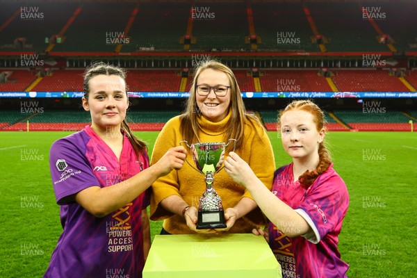 061225 - Cardiff Quins v Nelson Belles - WRU Girls U16 Hub Final - Captains of Cardiff Quins Alys Roberts(L) and Medi Roberts receive the cup from Carol Thomas of WRU