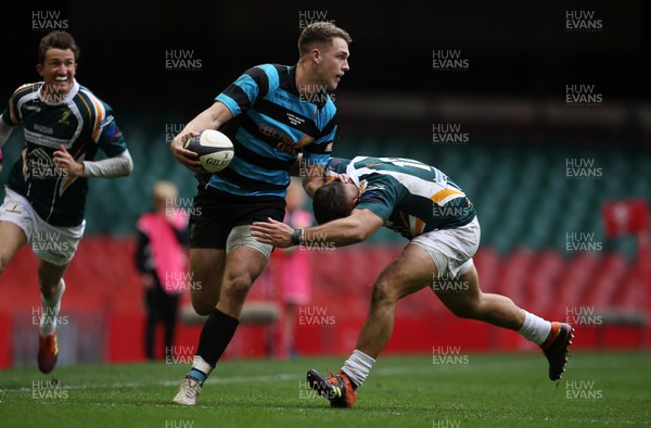 280419 - WRU Finals Day - National Cup - Cardiff RFC v Merthyr RFC - Max Llewellyn of Cardiff is tackled by Will Rees-Hole of Cardiff