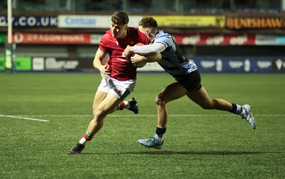 160126 - Cardiff RFC v Wales U20, Friendly match - Jack Woods of Wales is tackled by Dewi Cross of Cardiff RFC