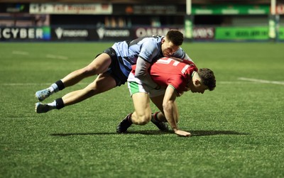 160126 - Cardiff RFC v Wales U20, Friendly match - Jack Woods of Wales is tackled by Dewi Cross of Cardiff RFC