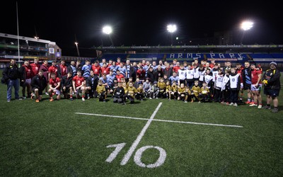 160126 - Cardiff RFC v Wales U20, Friendly match - Players and management from both teams join the guard of honour and ball team at the end of the match