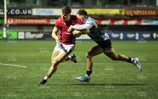 160126 - Cardiff RFC v Wales U20, Friendly match - Jack Woods of Wales is tackled by Dewi Cross of Cardiff RFC