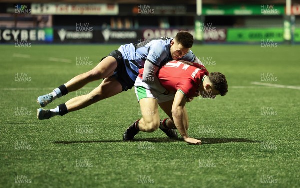 160126 - Cardiff RFC v Wales U20, Friendly match - Jack Woods of Wales is tackled by Dewi Cross of Cardiff RFC