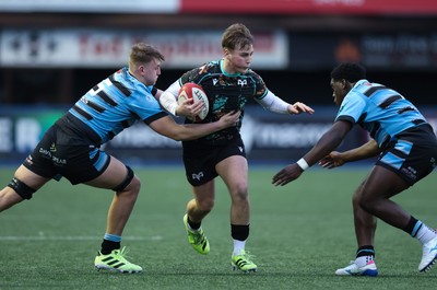 110126 - Cardiff Rugby U18s v Ospreys U18, WRU U18 Regional Age Grade Championship -  Zac Mizen of Ospreys takes on Evan Hughes of Cardiff Rugby and Brayan Kamanga of Cardiff Rugby