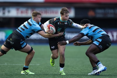 110126 - Cardiff Rugby U18s v Ospreys U18, WRU U18 Regional Age Grade Championship -  Zac Mizen of Ospreys takes on Evan Hughes of Cardiff Rugby and Brayan Kamanga of Cardiff Rugby