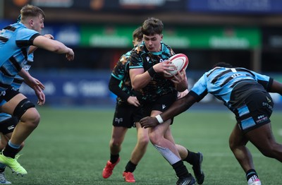 110126 - Cardiff Rugby U18s v Ospreys U18, WRU U18 Regional Age Grade Championship -  Aled Davies of Ospreys takes on Brayan Kamanga of Cardiff Rugby