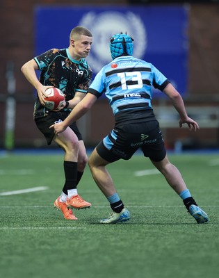 110126 - Cardiff Rugby U18s v Ospreys U18, WRU U18 Regional Age Grade Championship -  Dylan Quinn of Ospreys takes on Harry Kinsey of Cardiff Rugby