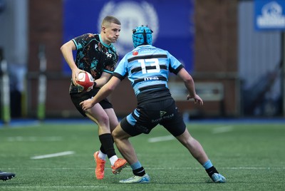 110126 - Cardiff Rugby U18s v Ospreys U18, WRU U18 Regional Age Grade Championship -  Dylan Quinn of Ospreys takes on Harry Kinsey of Cardiff Rugby