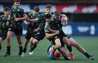 110126 - Cardiff Rugby U18s v Ospreys U18, WRU U18 Regional Age Grade Championship -  Dylan Quinn of Ospreys is tackled