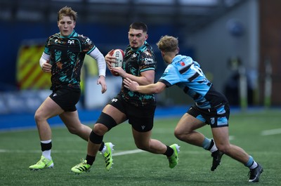 110126 - Cardiff Rugby U18s v Ospreys U18, WRU U18 Regional Age Grade Championship -  Ethan Bolch of Ospreys is tackled by Harvey Bryant of Cardiff Rugby