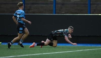 110126 - Cardiff Rugby U18s v Ospreys U18, WRU U18 Regional Age Grade Championship -  Dylan Quinn of Ospreys races in to score try