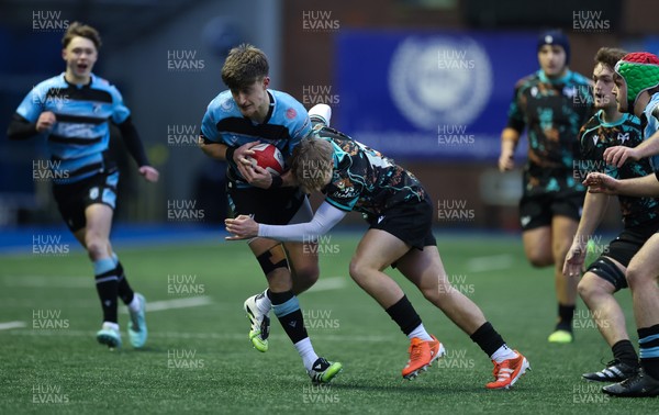 110126 - Cardiff Rugby U18s v Ospreys U18, WRU U18 Regional Age Grade Championship -  Isaac Manning Burke of Cardiff Rugby is tackled by Alfie Selby of Ospreys
