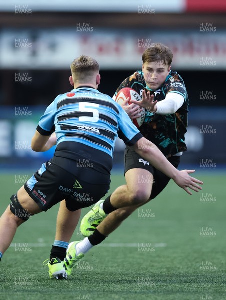 110126 - Cardiff Rugby U18s v Ospreys U18, WRU U18 Regional Age Grade Championship -  Zac Mizen of Ospreys takes on Evan Hughes of Cardiff Rugby