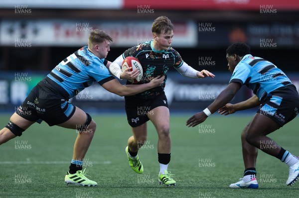 110126 - Cardiff Rugby U18s v Ospreys U18, WRU U18 Regional Age Grade Championship -  Zac Mizen of Ospreys takes on Evan Hughes of Cardiff Rugby and Brayan Kamanga of Cardiff Rugby