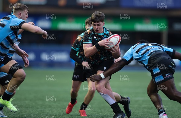 110126 - Cardiff Rugby U18s v Ospreys U18, WRU U18 Regional Age Grade Championship -  Aled Davies of Ospreys takes on Brayan Kamanga of Cardiff Rugby