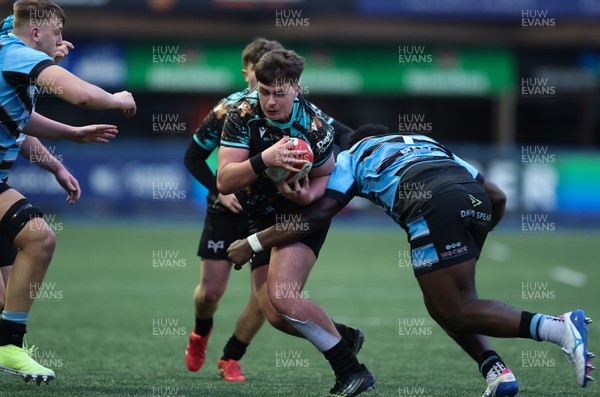 110126 - Cardiff Rugby U18s v Ospreys U18, WRU U18 Regional Age Grade Championship -  Aled Davies of Ospreys takes on Brayan Kamanga of Cardiff Rugby