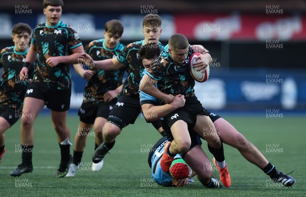110126 - Cardiff Rugby U18s v Ospreys U18, WRU U18 Regional Age Grade Championship -  Dylan Quinn of Ospreys is tackled