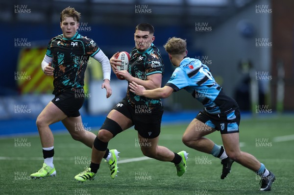 110126 - Cardiff Rugby U18s v Ospreys U18, WRU U18 Regional Age Grade Championship -  Ethan Bolch of Ospreys is tackled by Harvey Bryant of Cardiff Rugby