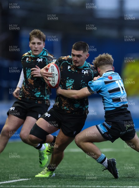110126 - Cardiff Rugby U18s v Ospreys U18, WRU U18 Regional Age Grade Championship -  Ethan Bolch of Ospreys is tackled by Harvey Bryant of Cardiff Rugby