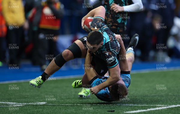 110126 - Cardiff Rugby U18s v Ospreys U18, WRU U18 Regional Age Grade Championship -  Ethan Bolch of Ospreys is tackled by Harvey Bryant of Cardiff Rugby