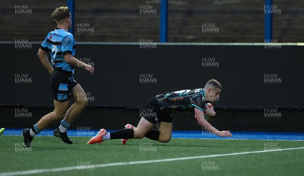 110126 - Cardiff Rugby U18s v Ospreys U18, WRU U18 Regional Age Grade Championship -  Dylan Quinn of Ospreys races in to score try