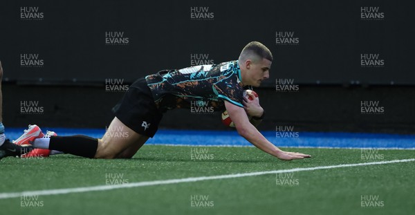 110126 - Cardiff Rugby U18s v Ospreys U18, WRU U18 Regional Age Grade Championship -  Dylan Quinn of Ospreys races in to score try