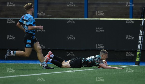 110126 - Cardiff Rugby U18s v Ospreys U18, WRU U18 Regional Age Grade Championship -  Dylan Quinn of Ospreys races in to score try