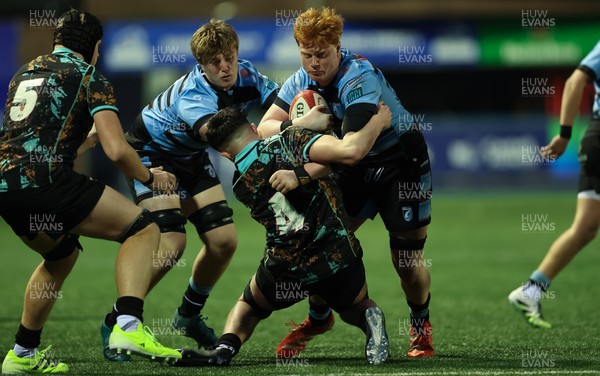 110126 - Cardiff Rugby U18s v Ospreys U18, WRU U18 Regional Age Grade Championship -  Sonny McCabe of Cardiff Rugby is tackled