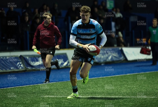 110126 - Cardiff Rugby U18s v Ospreys U18, WRU U18 Regional Age Grade Championship -  Will Adams of Cardiff Rugby races in to score try