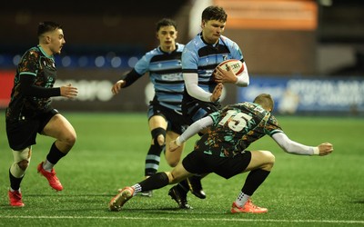 120226 - Cardiff Rugby U18 v Ospreys U18, WRU Regional Age Grade Championship Final - Ioan Leyshon of Cardiff takes on Dylan Quinn of Ospreys