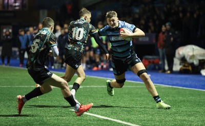 120226 - Cardiff Rugby U18 v Ospreys U18, WRU Regional Age Grade Championship Final - Lucca Alexander-White of Cardiff is tackled by  Dylan Quinn of Ospreys short of the line
