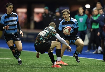 120226 - Cardiff Rugby U18 v Ospreys U18, WRU Regional Age Grade Championship Final - Harvey Bryant of Cardiff is tackled by Dylan Quinn of Ospreys