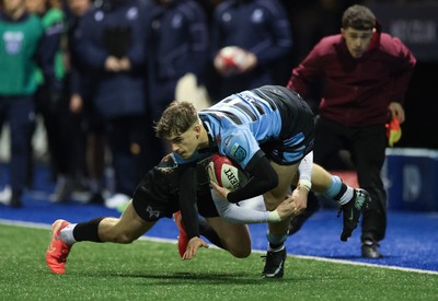 120226 - Cardiff Rugby U18 v Ospreys U18, WRU Regional Age Grade Championship Final - Harvey Bryant of Cardiff is tackled by Dylan Quinn of Ospreys
