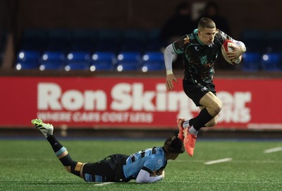120226 - Cardiff Rugby U18 v Ospreys U18, WRU Regional Age Grade Championship Final - Dylan Quinn of Ospreys takes on Isaac Manning-Burke of Cardiff