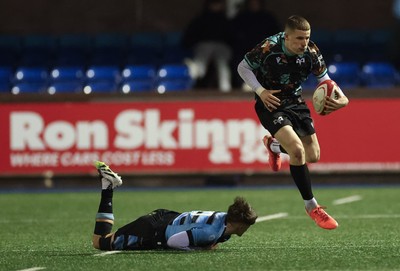 120226 - Cardiff Rugby U18 v Ospreys U18, WRU Regional Age Grade Championship Final - Dylan Quinn of Ospreys takes on Isaac Manning-Burke of Cardiff