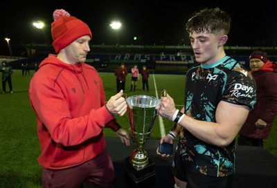 120226 - Cardiff Rugby U18 v Ospreys U18, WRU Regional Age Grade Championship Final - Wales U20 head coach Richard Whiffin presents Sam Morgan of Ospreys with the trophy