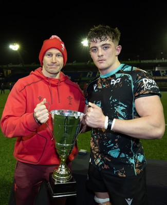 120226 - Cardiff Rugby U18 v Ospreys U18, WRU Regional Age Grade Championship Final - Wales U20 head coach Richard Whiffin presents Sam Morgan of Ospreys with the trophy