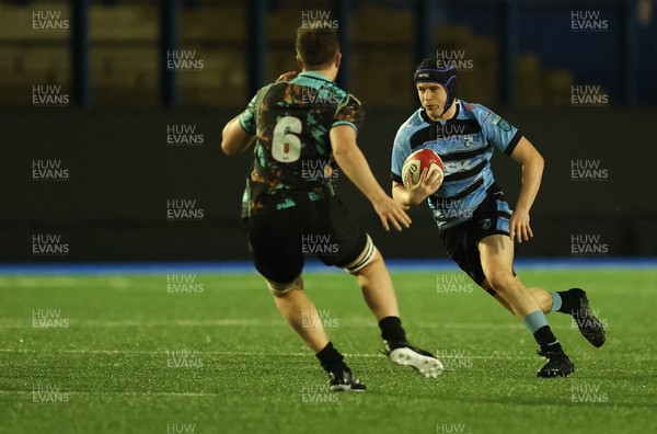 120226 - Cardiff Rugby U18 v Ospreys U18, WRU Regional Age Grade Championship Final - Owen Lewis of Cardiff takes on Freddie Millward of Ospreys and Cai Davies of Ospreys