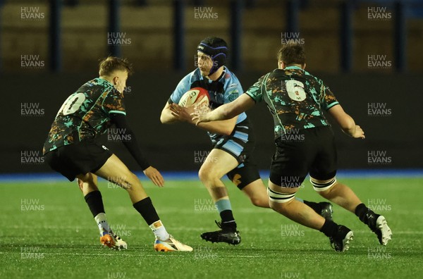 120226 - Cardiff Rugby U18 v Ospreys U18, WRU Regional Age Grade Championship Final - Owen Lewis of Cardiff takes on Freddie Millward of Ospreys and Cai Davies of Ospreys