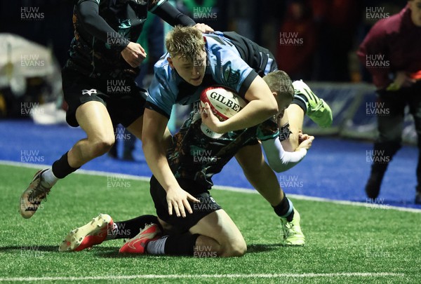 120226 - Cardiff Rugby U18 v Ospreys U18, WRU Regional Age Grade Championship Final - Lucca Alexander-White of Cardiff is tackled by  Dylan Quinn of Ospreys short of the line