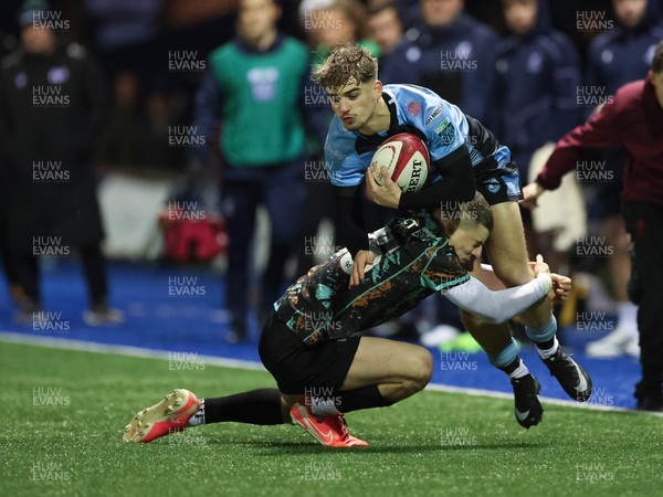 120226 - Cardiff Rugby U18 v Ospreys U18, WRU Regional Age Grade Championship Final - Harvey Bryant of Cardiff is tackled by Dylan Quinn of Ospreys