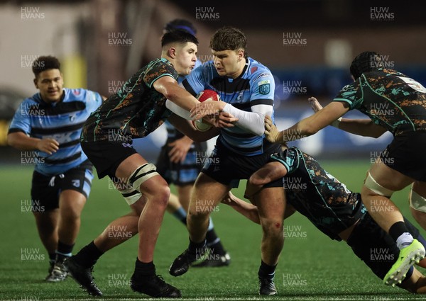 120226 - Cardiff Rugby U18 v Ospreys U18, WRU Regional Age Grade Championship Final - Ioan Leyshon of Cardiff is held