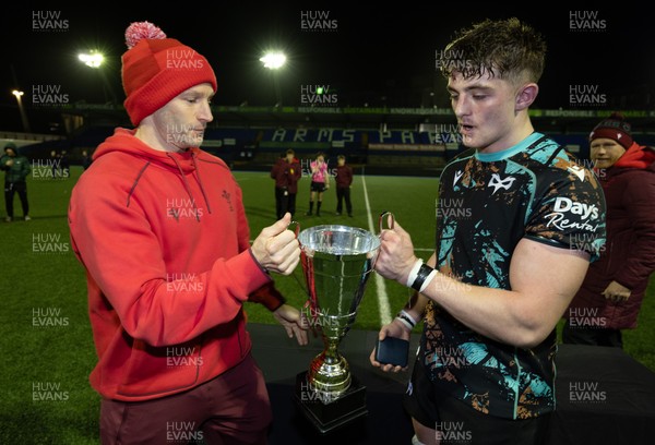 120226 - Cardiff Rugby U18 v Ospreys U18, WRU Regional Age Grade Championship Final - Wales U20 head coach Richard Whiffin presents Sam Morgan of Ospreys with the trophy